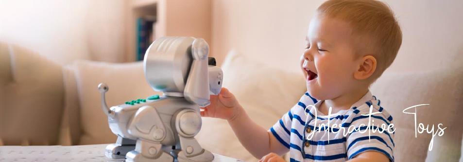 Happy toddler playing with interactive robot toy, fun educational play for babies and kids