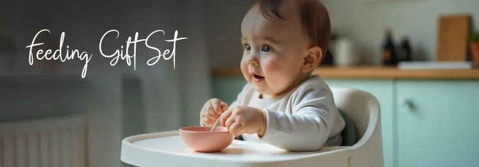 Baby in high chair with pink bowl, feeding gift set for infants and toddlers
