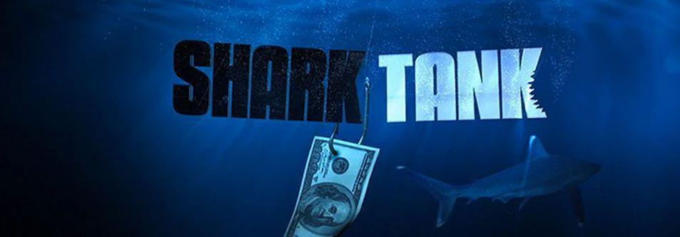 Shark Tank logo with dollar bill on hook underwater, shark swimming nearby