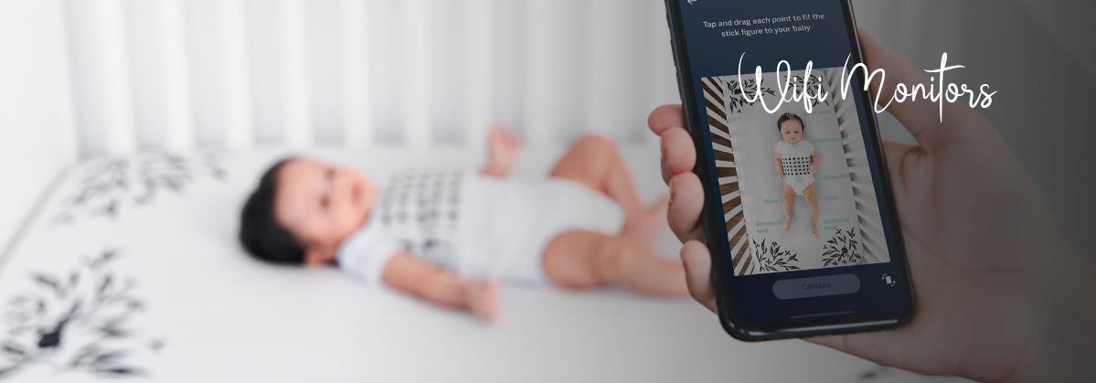 Baby sleeping in crib monitored via smartphone app, WiFi baby monitor for parents