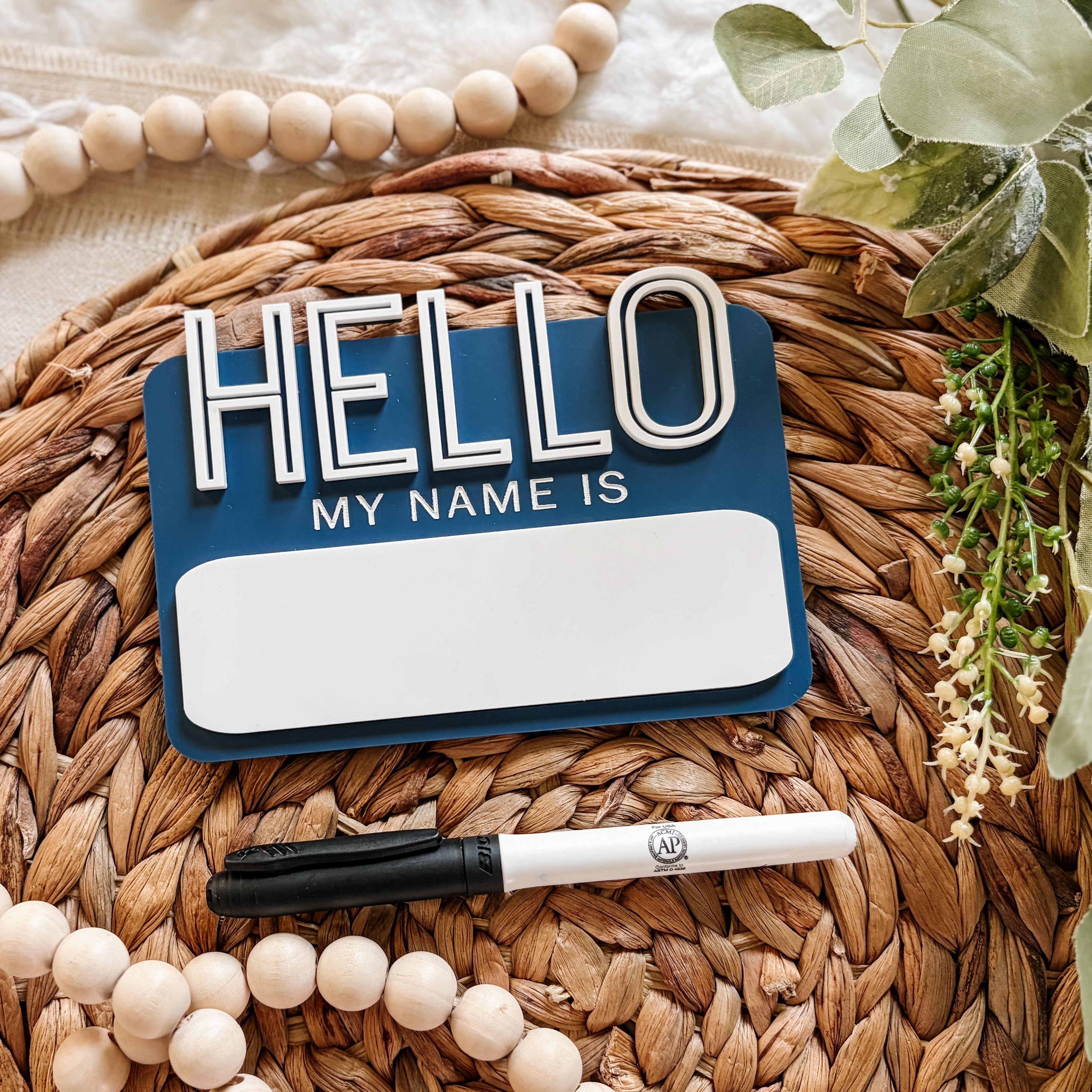 Hello My Name Is sign with pen on woven mat, baby nursery decor