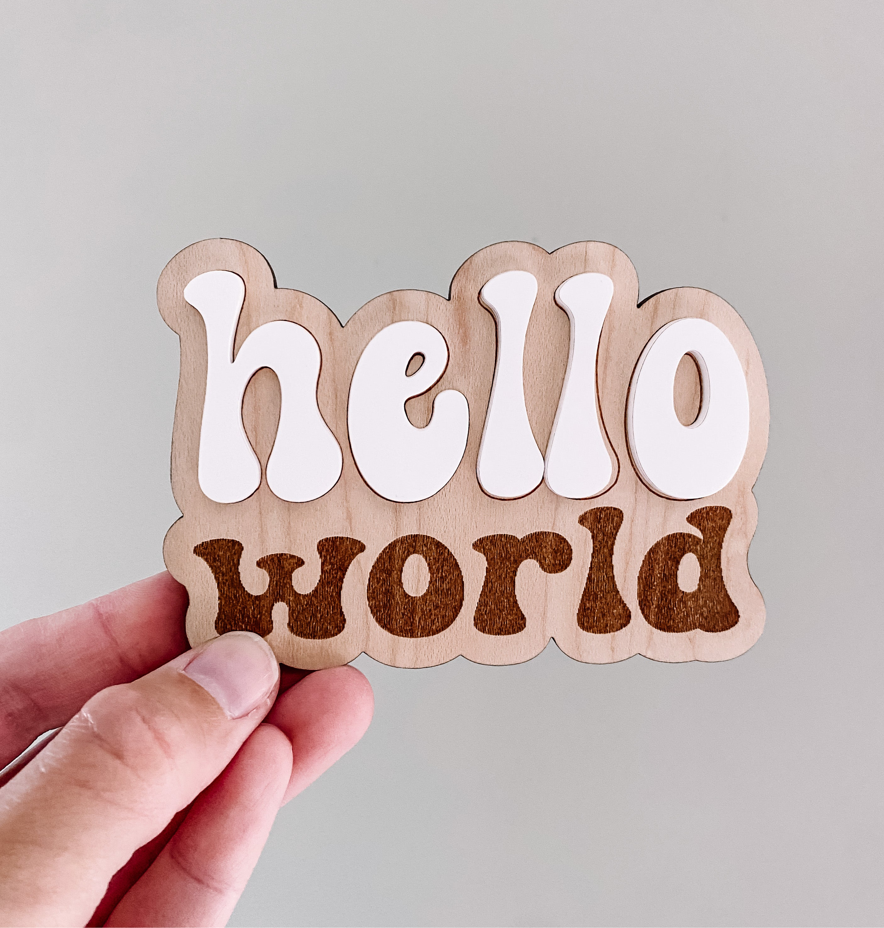 Wooden 'hello world' baby sign, perfect for newborn photos and nursery decor