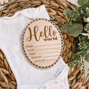 Hello World baby announcement sign on onesie with floral decor