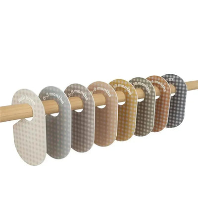 Set of 8 gingham closet dividers for baby clothes featuring age labels from newborn up to 24 months.