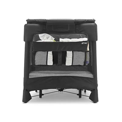 Black 4 Moms Breeze Diaper Storage Caddy with multiple compartments and mesh pockets, organized with diapers and supplies.