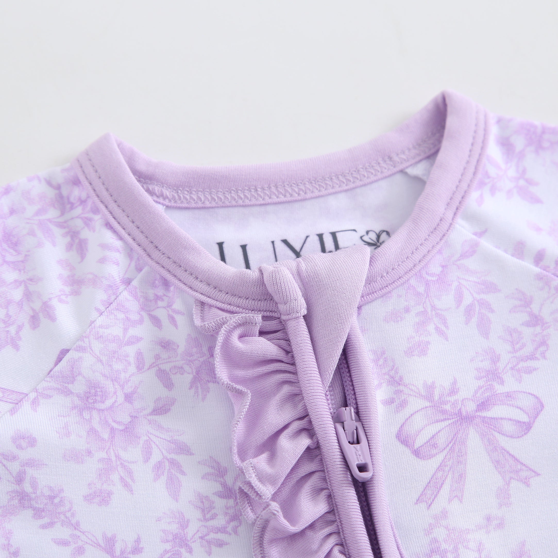 Bows & Blooms Ruffled Zippered Baby Romper