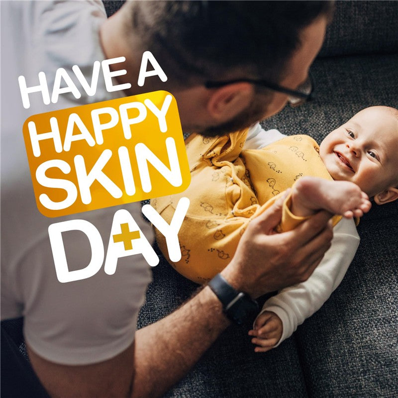 A parent and baby smiling while playing together on a couch, with text promoting healthy skin.