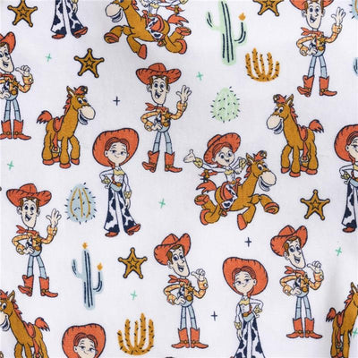Toy Story-themed fabric featuring characters such as Woody and Jessie, with western motifs and cacti.