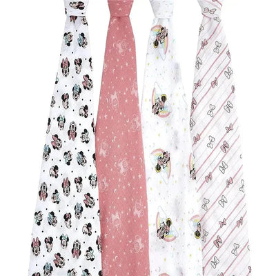 Four muslin swaddle blankets featuring Minnie Mouse designs, including rainbows and bows, in a pastel color palette.