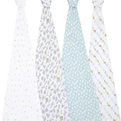 Muslin swaddles from Aden + Anais featuring four different designs, including alphabet letters and animal patterns.
