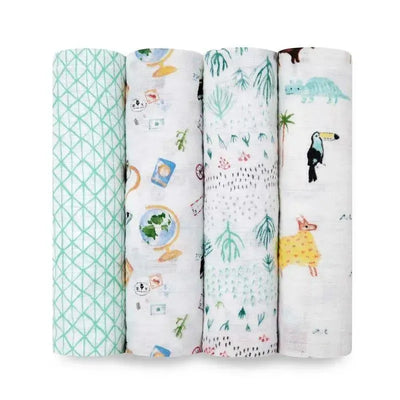 Four Aden + Anais swaddles featuring various patterns: green geometric, world map, tropical leaves, and animals.