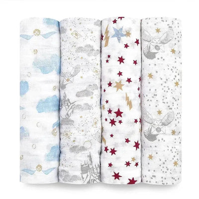 Four muslin swaddles featuring Harry Potter-themed designs, including stars, owls, and clouds in various colors.