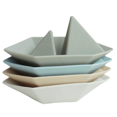 Four stacked mini-boat bath toys in soft colors: light gray, light blue, beige, and white. Perfect for playful bath time.
