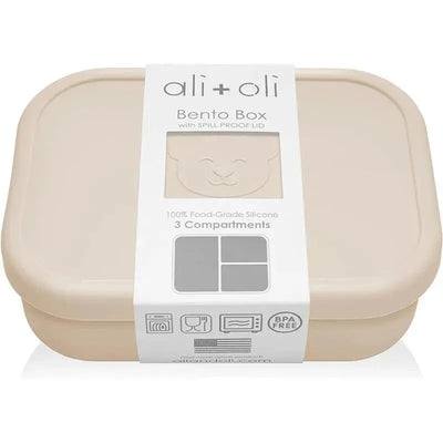 Leakproof silicone bento box by Ali + Oli in Coco color; features spill-proof lid and three compartments.