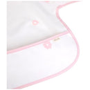 Long sleeve smock bib in pink with floral patterns, featuring a stitched label from Ali + Oli.