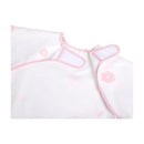 Long sleeve smock bib in pink with flower patterns, featuring a comfortable neck opening and adjustable closures.