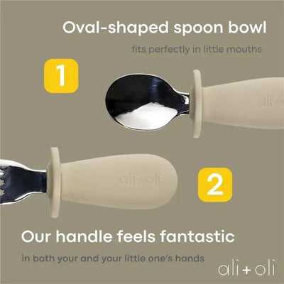 Oval-shaped spoon and fork learning set features soft handles, suitable for toddlers ages 6 months and up.