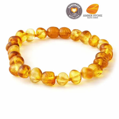Baroque Baltic amber bracelet featuring smooth, irregularly shaped amber beads in varying shades of yellow and orange.