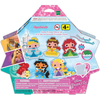 Aquabeads Disney Princess Dazzle Set featuring colorful bead designs of princesses, a warning label, and a background castle.
