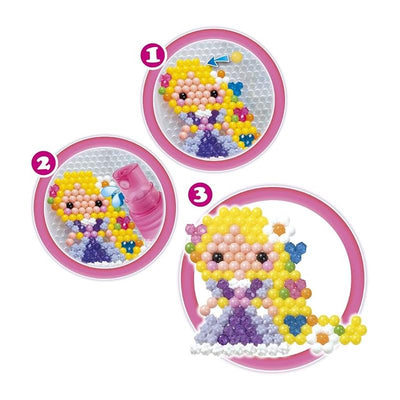 Aquabeads Disney Princess Dazzle Set with colorful beads forming a princess design, including a water sprayer for assembly.