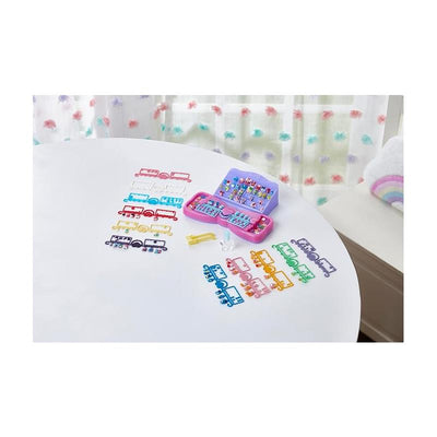 Aquabeads Hearts & Ribbons Nail Refill Kit displayed on a table, featuring colorful bead designs and a pink storage case.
