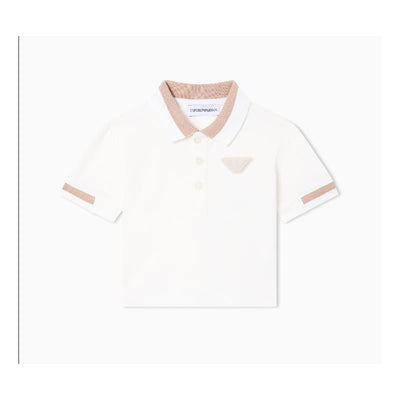 Short sleeve white polo shirt for baby boys featuring a tan collar and logo emblem on the chest.