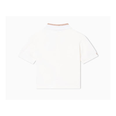 Short sleeve baby boy polo shirt in white with a contrasting collar.