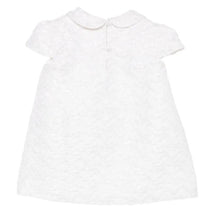 Baby girl dress in white with a textured pattern, short sleeves, and a Peter Pan collar, featuring a button closure at the back.