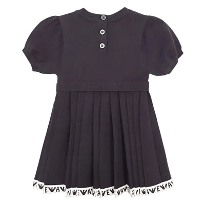 Navy short sleeve pleated dress for girls with a round neckline and button closures at the back, featuring a logo trim at the hem.