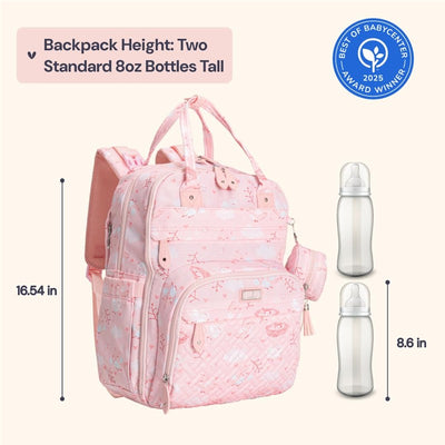 Diaper bag backpack in pink with bird patterns, featuring dimensions and two baby bottles for scale.