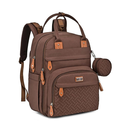 Brown travel essentials baby bag with a changing pad, featuring multiple pockets and a textured front panel.