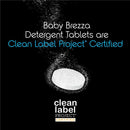 Baby Brezza Detergent Soap Tablets for bottle washing, Clean Label Project certified, on a black background with bubbles.