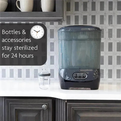 Baby Brezza One Step Baby Bottle Sterilizer and Dryer in charcoal, with a clock showing sterilization benefits for 24 hours.