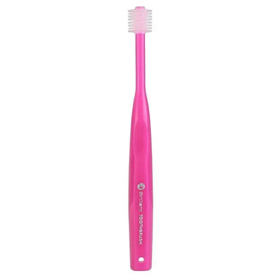 Brilliant Baby Toothbrush in vibrant pink with a soft bristle head designed for gentle cleaning of baby teeth.
