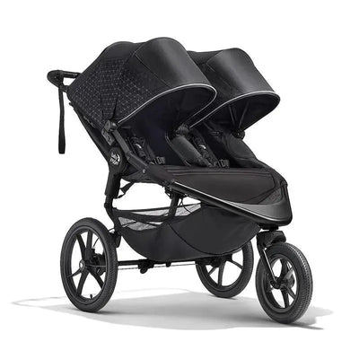 Double jogging stroller in Midnight Black, featuring two seats, sun canopies, and a storage basket.