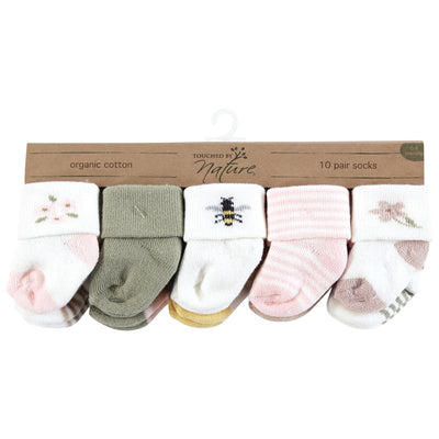 Ten pairs of organic cotton baby socks in soft colors and designs featuring flowers and bees, suitable for 0-6 months.
