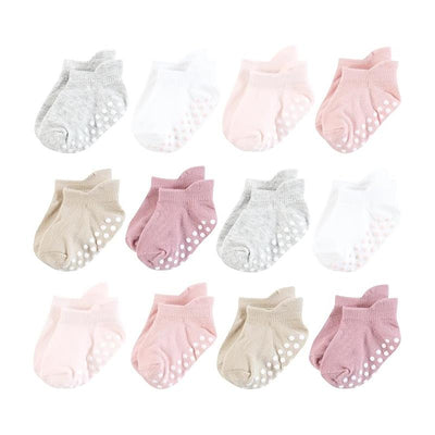 Twelve pairs of non-skid no show socks in mauve and neutral shades, featuring dotted grips on the soles.