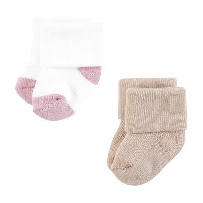 Set of four pairs of soft baby socks in assorted pastel colors, featuring a white and pink design and beige ribbed style.