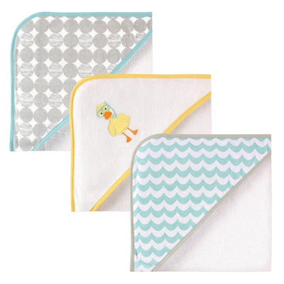 Three unisex baby cotton terry hooded towels featuring a yellow scuba duck, a polka dot design, and a wavy pattern.