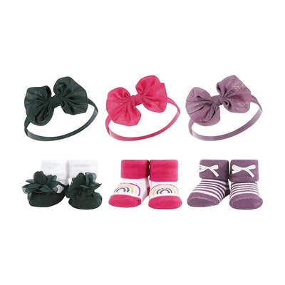 Chiffon bow headbands in green, pink, and purple with matching sock sets featuring floral designs and rainbow patterns.