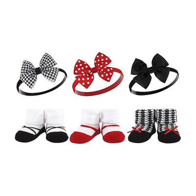 Six-piece baby headband and sock set featuring red houndstooth patterns and various colored bows in black and red.