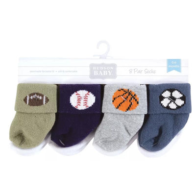 Cotton-rich newborn socks set includes eight pairs with sports-themed designs: football, baseball, basketball, and paw prints.