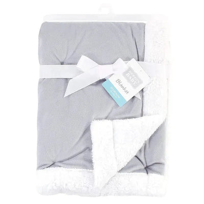 Baby Vision Blanket in gray and white, featuring a soft Sherpa back, tied with a ribbon and a tag displaying product details.