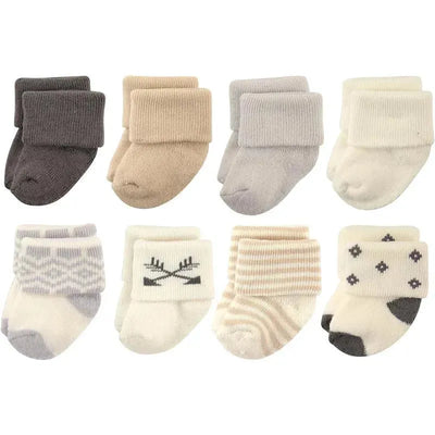 Cotton-rich newborn socks for baby girls, featuring various muted colors and patterns in an 8-pack.