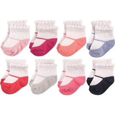 Eight pairs of baby girl socks in various colors with ruffled tops, suitable for 12-24 months, by Hudson Baby.