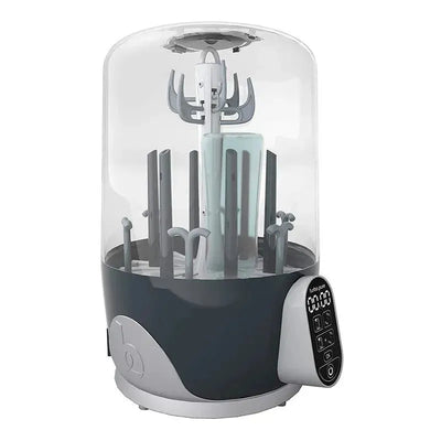 Babymoov Turbo Pure Sterilizer with a transparent cover, multiple compartments for bottles, and a digital control panel.