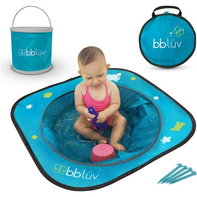 Baby sitting in a blue Bbluv Arenä beach pool, playing with a toy, surrounded by a bucket and stakes.