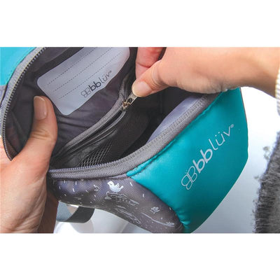 Toddler backpack by Bbluv in aqua, showing a person accessing the zippered inner pocket with organizational features.