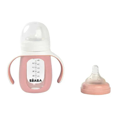 Beaba 2-In-1 Glass Training Cup in rose color with easy-grip handles and removable silicone spout.