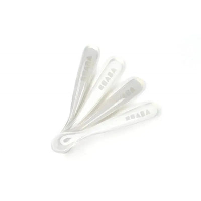 Set of four Beaba silicone spoons for infants, designed in soft cloud color, ideal for first stage feeding.